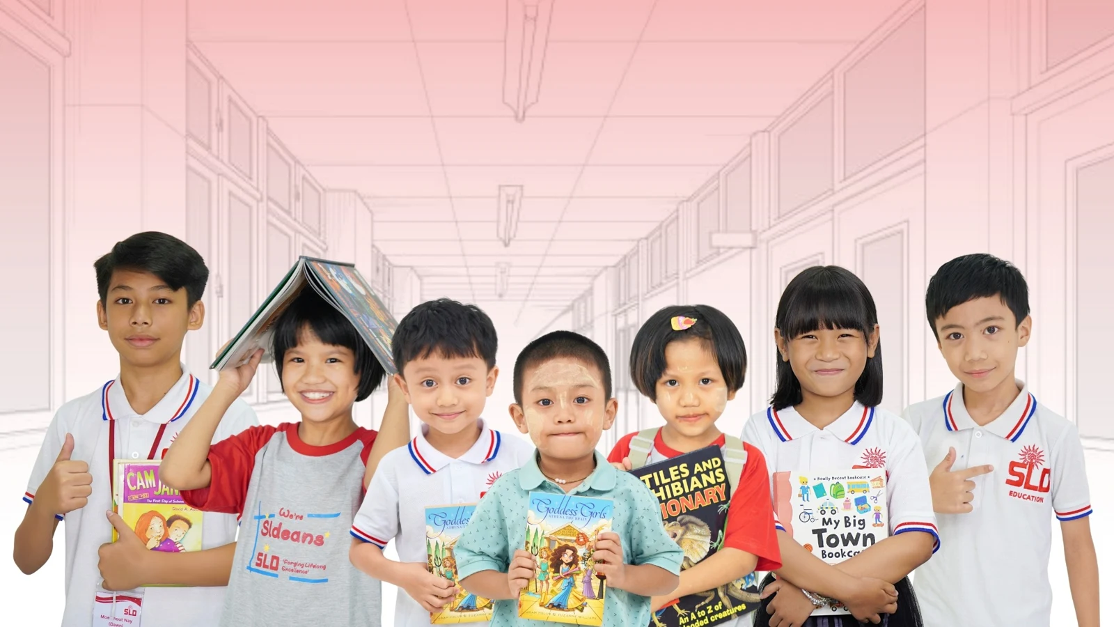 Young SLD learners holding books
